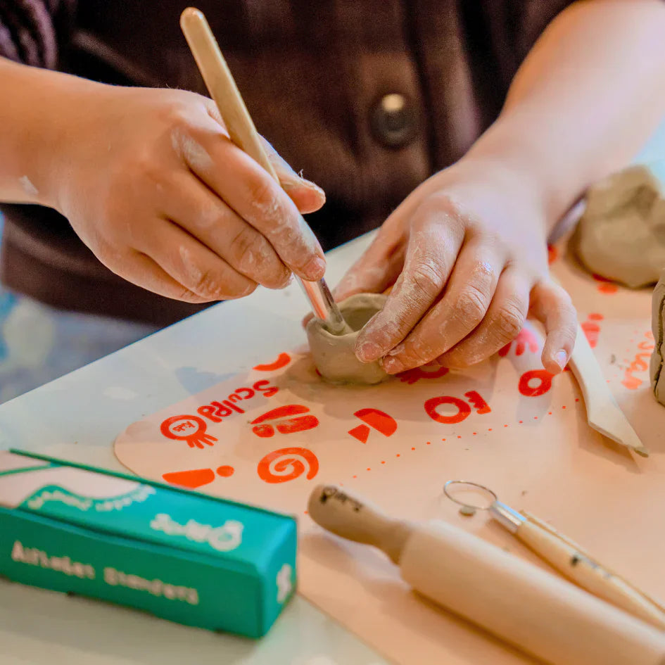 A kid working on his Sculpd kids pottery