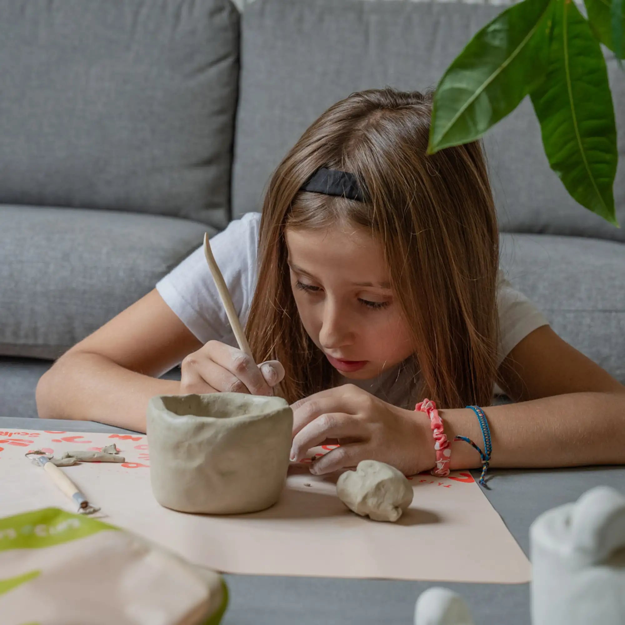 Crafting pottery with Sculpd kids mess mat 