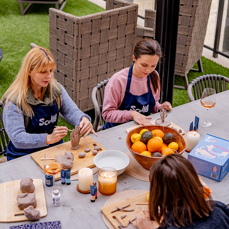 Friends enjoying pottery experience kit