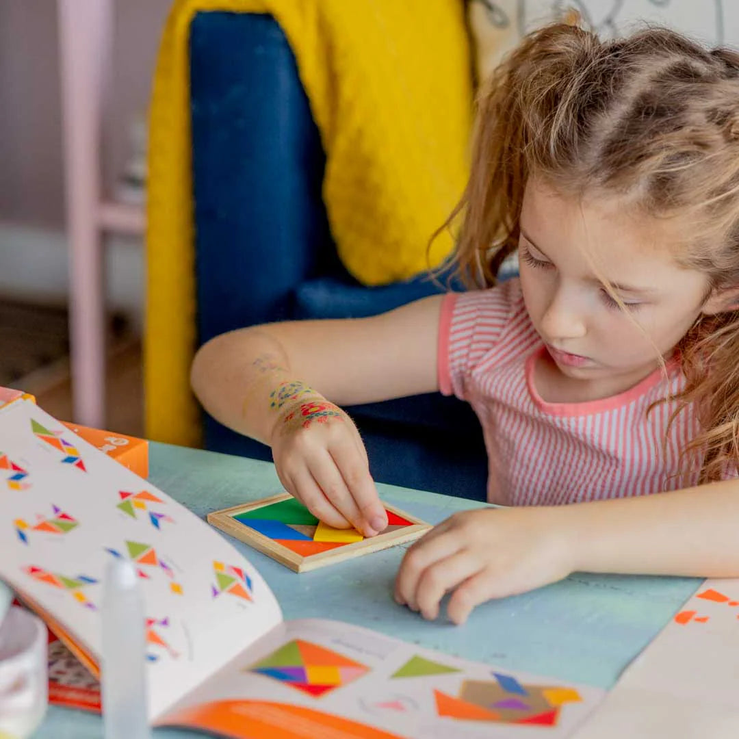 Kids playing with tangram tiles with Sculpd kids blast off kit